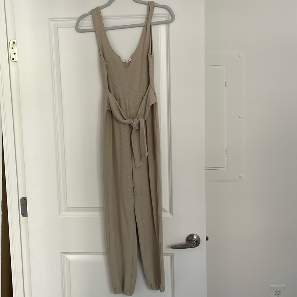Cream jumpsuit with tie